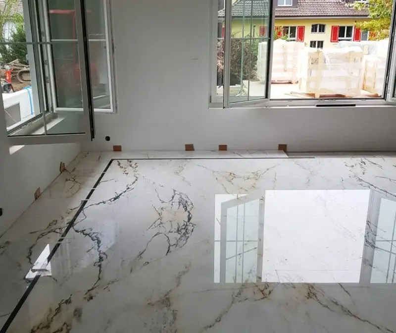 Marble floor being polished to restore its natural shine in a Dubai home